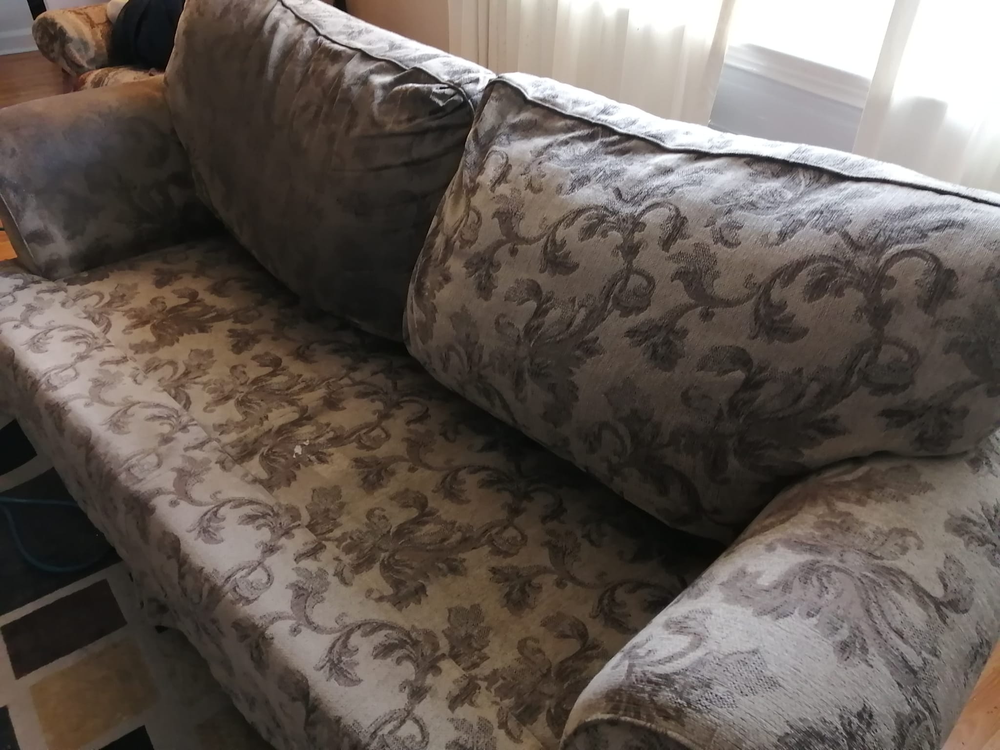 Grey sofa before cleaning